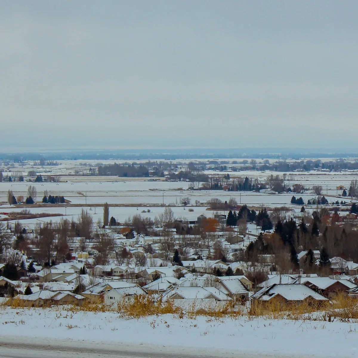 A snow-covered Rexburg neighborhood and surrounding fields
