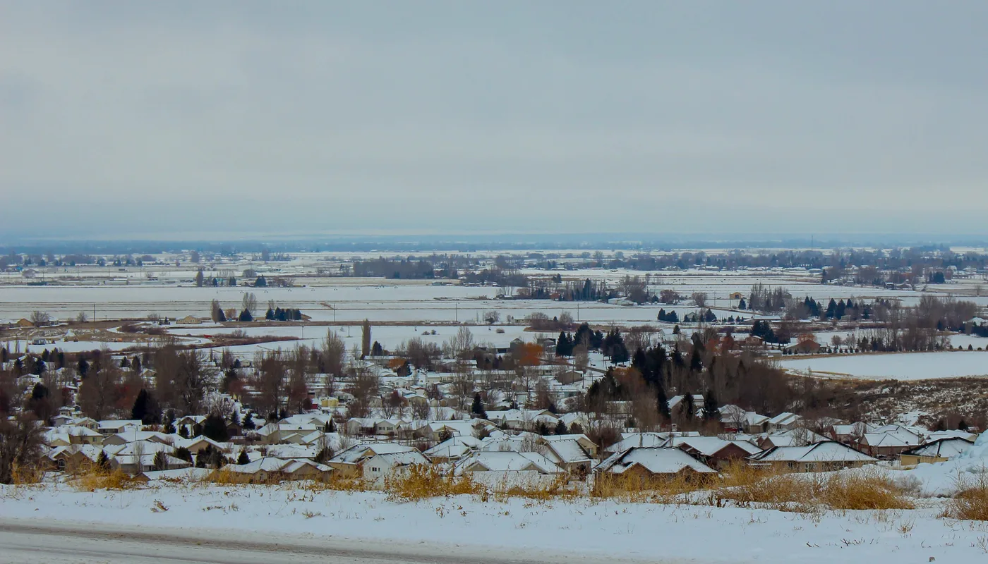 A snow-covered Rexburg neighborhood and surrounding fields